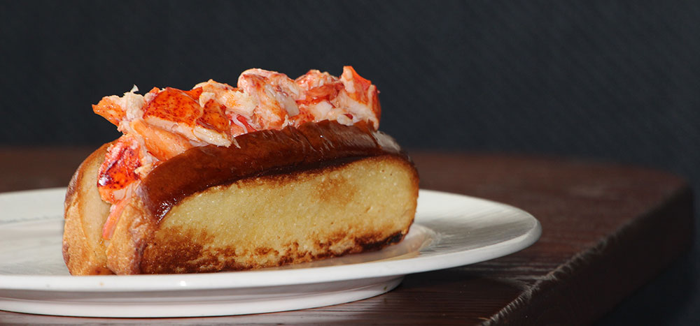 Delicous looking lobster roll on a buttery garlic bread bun